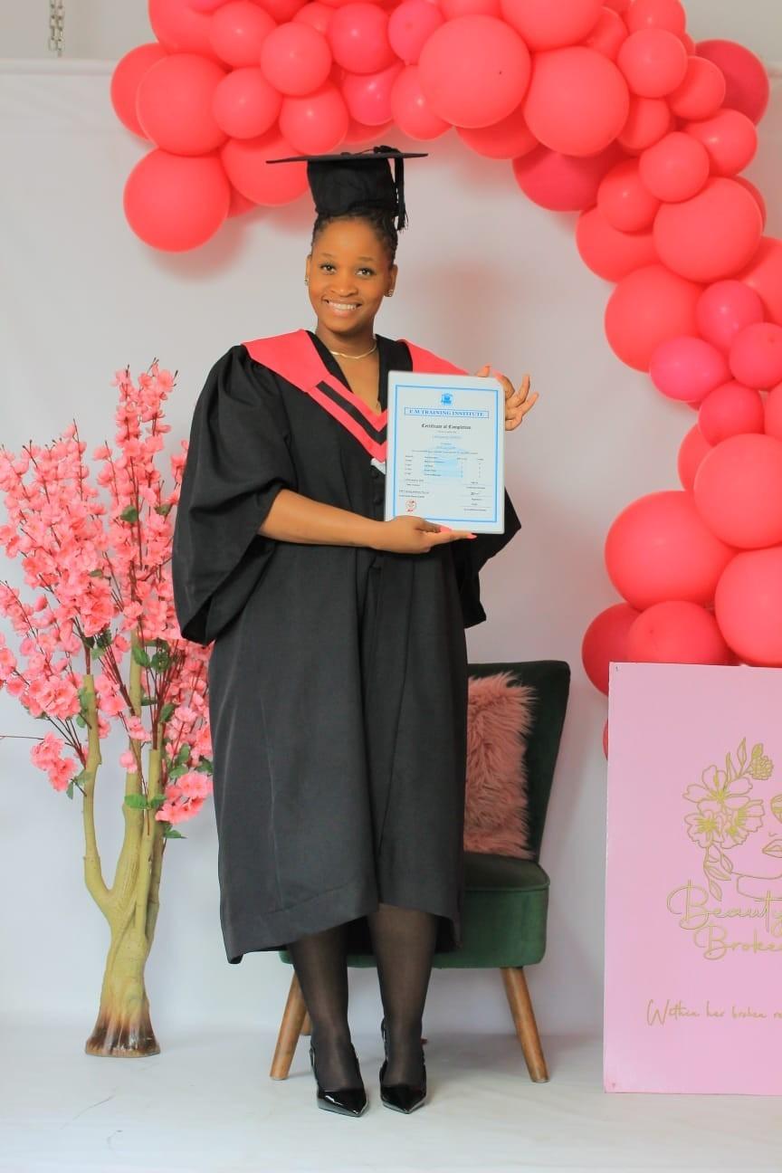 Graduate with her training certificate